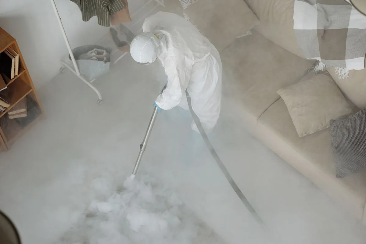 Biohazard cleanup technician in protective equipment, Somerdale, NJ